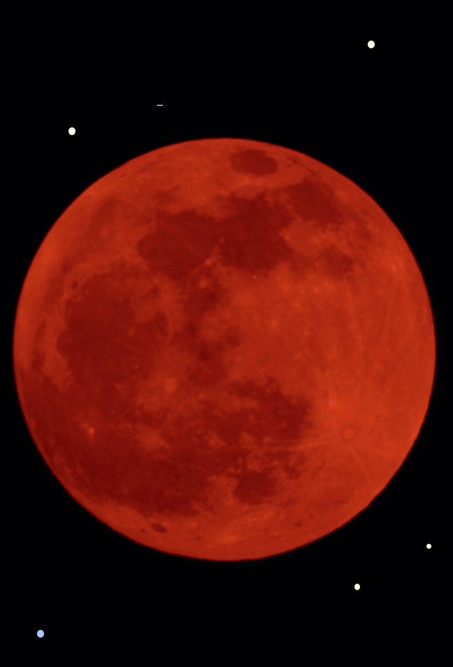 A full moon, deep red, in a black sky.